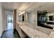 Bathroom featuring marble countertops, black tile flooring, a glass shower, and a soaking tub at 750 Park Ne Ave # 13E, Atlanta, GA 30326