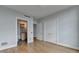 A cozy bedroom with wooden floors and a bathroom connected to it at 750 Park Ne Ave # 13E, Atlanta, GA 30326