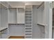 A walk-in closet featuring shelving and gold hardware at 750 Park Ne Ave # 13E, Atlanta, GA 30326