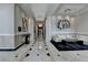 Long hallway with marble floors, sophisticated lighting, and contemporary art at 750 Park Ne Ave # 13E, Atlanta, GA 30326