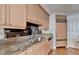 Kitchen featuring wood cabinets, granite countertops, stainless steel appliances, sink, and hardwood floors at 750 Park Ne Ave # 13E, Atlanta, GA 30326