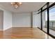 Living area with hardwood floors, crown molding, large windows, and a balcony at 750 Park Ne Ave # 13E, Atlanta, GA 30326