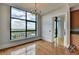 Living Area with a large window, hardwood floors, and chandelier at 750 Park Ne Ave # 13E, Atlanta, GA 30326