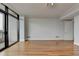 Spacious living room boasts hardwood floors and a sliding glass door providing access to a balcony at 750 Park Ne Ave # 13E, Atlanta, GA 30326
