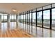 Bright, spacious living room features hardwood floors and expansive windows with city views at 750 Park Ne Ave # 13E, Atlanta, GA 30326