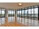 Open-concept living space with hardwood floors and floor-to-ceiling windows showcasing city views at 750 Park Ne Ave # 13E, Atlanta, GA 30326