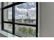 An exterior view of the city from the apartment building's floor to ceiling window at 750 Park Ne Ave # 13E, Atlanta, GA 30326