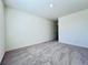 Spacious bedroom with plush carpeting and neutral paint, perfect for relaxation at 7744 Sudbury Cir, Covington, GA 30014