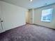 Bedroom with carpet, neutral walls, and natural light through a window at 7744 Sudbury Cir, Covington, GA 30014