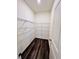 Spacious pantry offers ample storage with wire shelving and wood-look flooring at 7744 Sudbury Cir, Covington, GA 30014