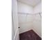 Spacious walk-in closet with wire shelving and carpeted floor at 7744 Sudbury Cir, Covington, GA 30014