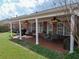 Charming covered back patio with outdoor seating and ceiling fans at 1042 Pecan Grove Pl, Lawrenceville, GA 30046