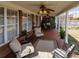 Inviting covered patio with comfortable seating and view of landscaped backyard at 1042 Pecan Grove Pl, Lawrenceville, GA 30046