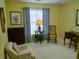 Cozy bedroom featuring a comfortable armchair and a window for natural light at 1042 Pecan Grove Pl, Lawrenceville, GA 30046