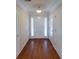 Entryway with wood floor, white trim, and a door with sidelights at 1042 Pecan Grove Pl, Lawrenceville, GA 30046