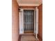 Front door with sidelights, brick facade and a decorative lantern at 1042 Pecan Grove Pl, Lawrenceville, GA 30046