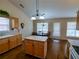Functional kitchen featuring an island and open dining space with hardwood floors at 1042 Pecan Grove Pl, Lawrenceville, GA 30046
