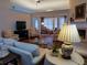 Bright living room with a fireplace, hardwood floors, and neutral-toned furniture at 1042 Pecan Grove Pl, Lawrenceville, GA 30046