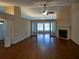 Spacious living room with hardwood floors, fireplace and ceiling fan at 1042 Pecan Grove Pl, Lawrenceville, GA 30046
