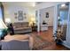 Cozy living room filled with natural light, hardwood floors, and comfortable seating at 1042 Pecan Grove Pl, Lawrenceville, GA 30046