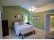 Spacious main bedroom with a ceiling fan and ensuite bathroom at 1042 Pecan Grove Pl, Lawrenceville, GA 30046