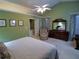 Spacious main bedroom with a ceiling fan and ensuite bathroom at 1042 Pecan Grove Pl, Lawrenceville, GA 30046
