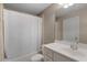 Bathroom featuring a shower-tub combo, vanity, and white ceramic tile at 2788 Bridle Ridge Way, Buford, GA 30519