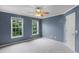 Bedroom with two windows and fan offering plenty of natural light at 2788 Bridle Ridge Way, Buford, GA 30519