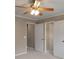 Neutral bedroom features several interior doors and soft carpet at 2788 Bridle Ridge Way, Buford, GA 30519