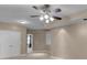 Bedroom featuring a ceiling fan, double door closet, and neutral colored walls at 2788 Bridle Ridge Way, Buford, GA 30519
