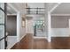 Inviting foyer with hardwood floors, staircase, and detailed trim work leading to the upper level at 2788 Bridle Ridge Way, Buford, GA 30519