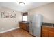 Updated kitchen featuring stainless steel appliances, granite countertops, and wood floors at 2788 Bridle Ridge Way, Buford, GA 30519