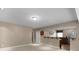 Cozy living area with an open layout to a modern kitchen with wood floors at 2788 Bridle Ridge Way, Buford, GA 30519