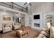 Comfortable living room showcasing a fireplace, built-in shelves, balcony and an open layout at 2788 Bridle Ridge Way, Buford, GA 30519