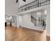 Open-concept living room features soaring ceilings, hardwood floors, and a staircase to the second floor at 2788 Bridle Ridge Way, Buford, GA 30519