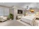 Bright main bedroom features neutral decor, a ceiling fan, and a large window at 2788 Bridle Ridge Way, Buford, GA 30519