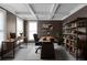 Well-lit home office with coffered ceilings, custom built-ins, and a spacious desk area at 2788 Bridle Ridge Way, Buford, GA 30519