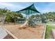 View of the community playground featuring a slide, climbing structure, and shaded canopy at 2788 Bridle Ridge Way, Buford, GA 30519
