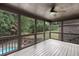 Spacious screened porch overlooking a backyard with a pool at 2788 Bridle Ridge Way, Buford, GA 30519