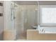 Updated shower featuring glass surround, tile, and built in bench at 2788 Bridle Ridge Way, Buford, GA 30519