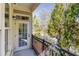 A spacious outdoor balcony with a black railing, views of trees and the nearby neighborhood at 11 Perimeter E Ctr # 1404, Atlanta, GA 30346