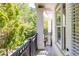 A charming balcony with an iron railing offering views of lush greenery and the surrounding neighborhood at 11 Perimeter E Ctr # 1404, Atlanta, GA 30346