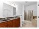 Bathroom features double vanity, walk-in shower, and soaking tub at 11 Perimeter E Ctr # 1404, Atlanta, GA 30346