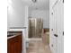 Bright bathroom with a tiled shower and soaking tub, as well as dark wood cabinets at 11 Perimeter E Ctr # 1404, Atlanta, GA 30346
