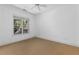 Bright bedroom with large window and plush neutral carpeting at 11 Perimeter E Ctr # 1404, Atlanta, GA 30346
