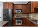A kitchen featuring stainless appliances and granite countertops at 11 Perimeter E Ctr # 1404, Atlanta, GA 30346