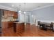 Kitchen area showing stainless appliances, granite countertops, wood cabinets, and hardwood floors at 11 Perimeter E Ctr # 1404, Atlanta, GA 30346