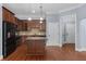 An open kitchen featuring granite countertops, a center island, and stainless steel appliances at 11 Perimeter E Ctr # 1404, Atlanta, GA 30346