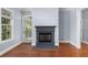 Bright living room features a fireplace, hardwood floors, and a door to the outside at 11 Perimeter E Ctr # 1404, Atlanta, GA 30346