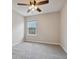 Bedroom with neutral carpet, ceiling fan, and natural light at 1575 April Ln, Morrow, GA 30260